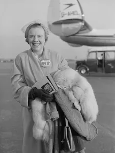 00102 Prints: Mrs Eric Burt just stepping of the BOAC flight from the USA wearing