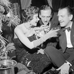 Christmas Tree Prints: Mrs Eunice Gayson and Reg North at the Room 21 Christmas party December 1954