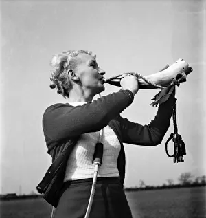 Blowing Prints: Mrs. Florence Suthers of the North Cheshire Bowmen blowing the foresters horn which was