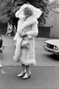 Mrs. Gertrude Shilling wearing a Ostrich feather hat with white Mink and Fox fur coat