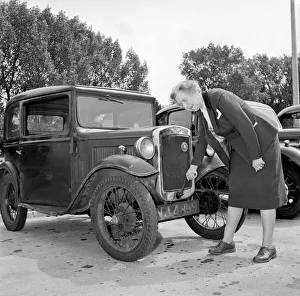 Old People Prints: Mrs Goul attempting to start her motor car by using the starting handle