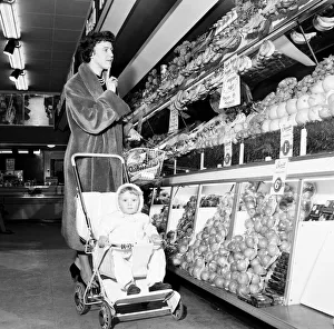 Apples Prints: Mrs J Evans in a pensive mood in the green grocery section of the newly opened