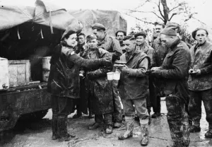 Italy Prints: Mrs Jean Finnigan serves 5th army men their morning tea and buns. Mrs