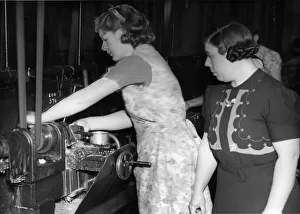 01465 Prints: Mrs Knight gets down to some tank parts under the eye of forewoman Mrs Jeanings at a