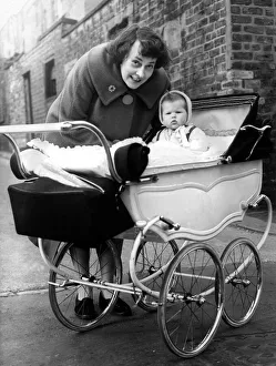 Two People Only Prints: Mrs L jackson, of Cross Parade, with Susan in a pram which cost 5 on 23rd March 1961