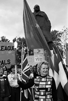 Mrs Margaret Thatcher March 1975 holding the European flag under the statue of Sir