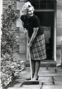 MRS. MARGARET THATCHER SWEEPS UP OUTSIDE HER HOME IN CHEYNE WALK