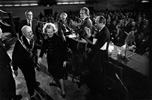 Mrs. Margaret Thatcher Talks to Tradesmen. Mrs. Margaret Thatcher leaves the Hall to a