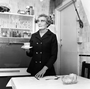 Saucer Prints: Mrs Mary Fullaway sets a place at her table in her Corporation house in Aycliffe Avenue