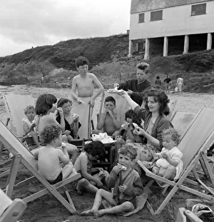 Mrs Mavis Graham and her 12 children seen here having a picnic beside the sea at Bigbury