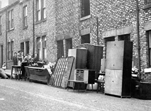 Mrs. McGeorges furniture stands outside her home in John Street