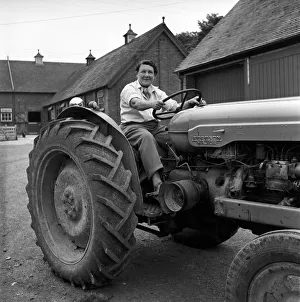 Mrs. Moss a livestock farmer seen here driving a Ferguson tractor around the farm. 1954