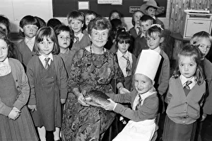 Bread Prints: Mrs Rita Manchester receives a loaf of bread from six-year old Angela Chapman after a