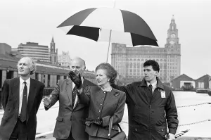 Raining Prints: Mrs Thatcher takes a look at Liverpool with Antony Newton MP (left) and Trevor Furlong