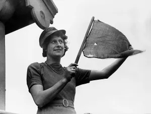 Signalman Prints: Mrs Village an LNER railway worker signals to a train during WW2. 1941