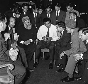 Discussion Prints: Muhammad Ali (Cassius Clay) speaking to Muslims holding a book called Towards