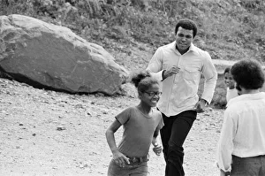 Muhammad Ali chasing a little girl at his training camp in Pennsylvania