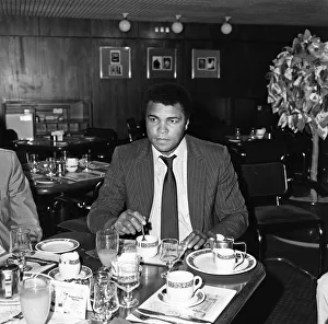 Heavy Weight Prints: Muhammad Ali enjoying a meal before his journey back to Chicago USA after his stay here