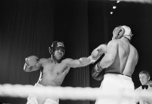 00775 Prints: Muhammad Ali having fun with a spectator at boxing exhibition match in Birmingham