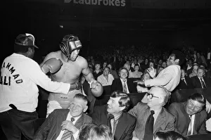00775 Prints: Muhammad Ali having fun with a spectator at boxing exhibition match in Birmingham