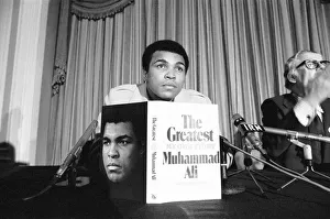 Microphones Prints: Muhammad Ali holding a press conference to publicise his book