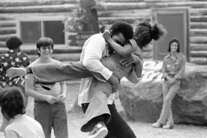 Kids Prints: Muhammad Ali hugging a little girl at his training camp in Pennsylvania