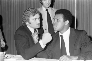 Muhammad Ali and Joe Bugner at a press conference for their upcoming fight