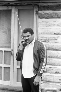 00435 Prints: Muhammad Ali keeps in touch with friends and family from his training camp. 2nd May 1980