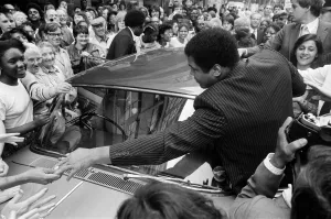 Muhammad Ali is mobbed by fans and supporters in the streets of Birmingham