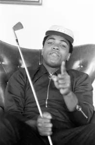 Muhammad Ali pictured having a round of tea-cup golf at his hotel near Dublin Ireland