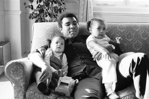 Toddler Prints: Muhammad Ali plays doting father in a London Hotel to daughters Laya
