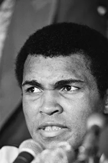 Microphones Prints: Muhammad Ali at a press conference for his World Title fight against Leon Spinks