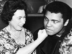 Muhammad Ali with Queen lookalike Jeanette Charles at Boxer John Contehs new night club