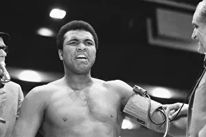 Portrait Posed Prints: Muhammad Ali seen here having his blood pressure taken during thge pre fight medical