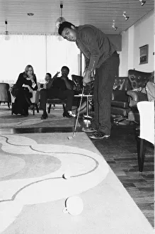 00328 Prints: Muhammad Ali seen here playing a round of tea cup golf at his hotel near Dublin