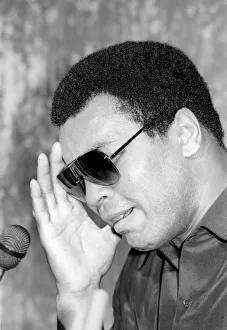 00326 Prints: Muhammad Ali seen here at the post fight press conference following his lost to Larry
