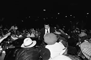Autographs Prints: Muhammad Ali signing to enthusiastic fans in Handsworth Birmingham. 6th August 1983