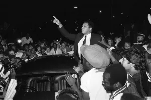 Muhammad Ali speaking to enthusiastic fans in Handsworth Birmingham