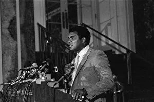 Microphones Prints: Muhammad Ali speaking at a press conference ahead of his upcoming fight against World
