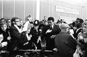 Muhammad Ali at a supermarket in Stretford to promote Ovaltine making a quick get away
