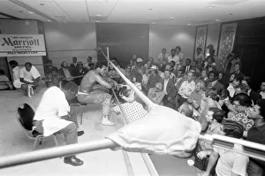 Muhammad Ali takes a break from training to talk to the press ahead of his rematch with