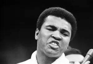 Portrait Posed Prints: Muhammad Ali talking to the press in his training camp ahead of his first fight with Joe
