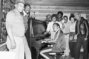 Muhammad Ali at his training camp, enjoys a sing song with those who work for him on 2nd