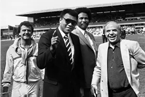 Heavy Weight Prints: Muhammad Ali wave to the St Andrews crowd watched by councillor James Hunte