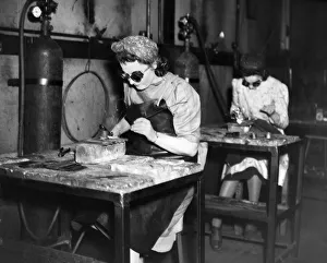 Munition girls at work in a factory in England during the Second World War