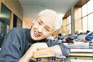 Muriel Gray leaning on desk with toy American truck TV Presenter A&copy;mirrorpix