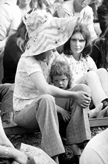Hippy Collection: Music fan with young child at The Isle of Wight Festival. 30th August 1970