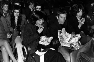 Chips Prints: Music fans eat their fish and chips at the Sophia Gardens Pavilion in Cardiff whilst