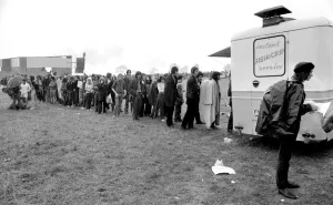Hippies Prints: Music Fans queue for fish & chips at the Bath Festival of Blues & Progressive Music