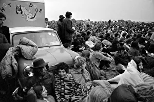 Music fans surround a Mini Hot Dog'van at The Isle of Wight Festival